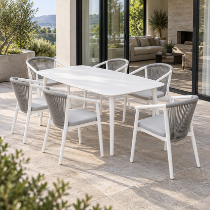 Lifestyle view: Paros Outdoor Dining Set, photographed in a quiet outdoor courtyard