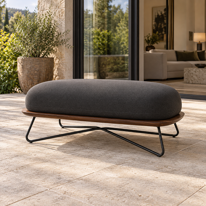 Lifestyle view: Positano Ottoman, photographed in a quiet outdoor courtyard