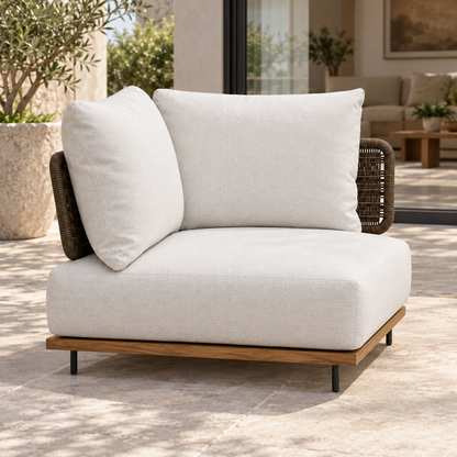 Lifestyle view: Ravello Corner Module, photographed in a quiet outdoor courtyard