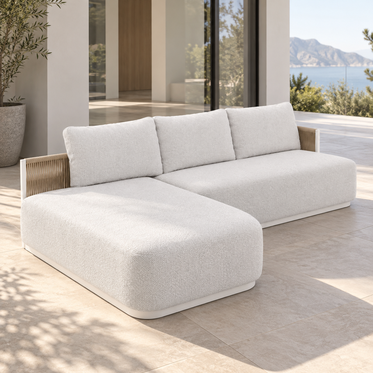 Ripple Chaise Sectional in Aluminium, left three-quarter view on a coastal home terrace