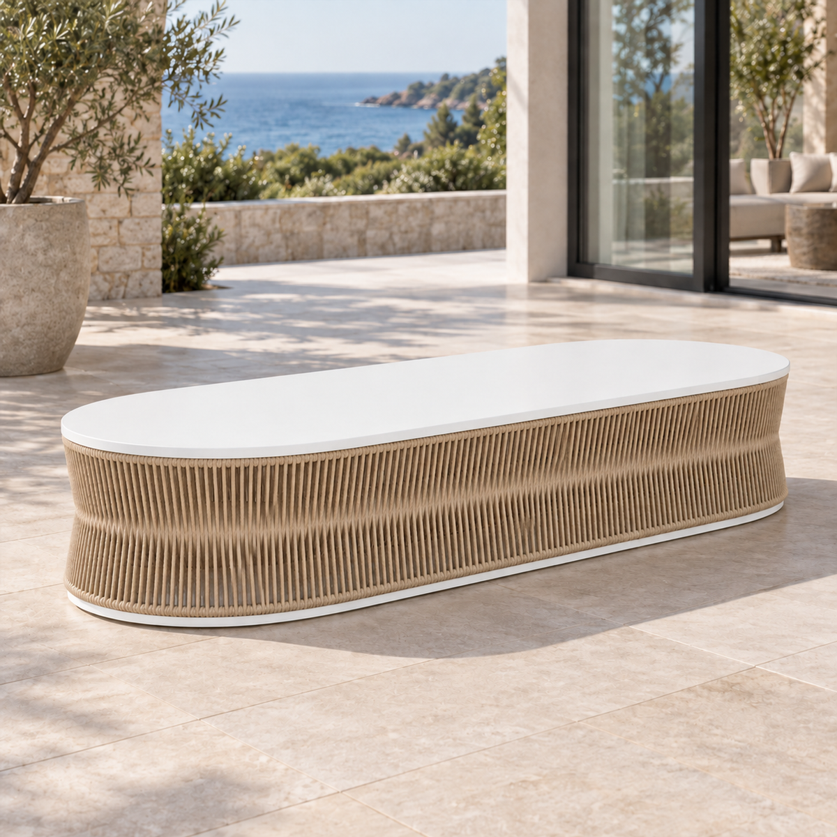 Lifestyle view: Ripple Coffee Table in Aluminium, opposite diagonal on a furnished coastal terrace