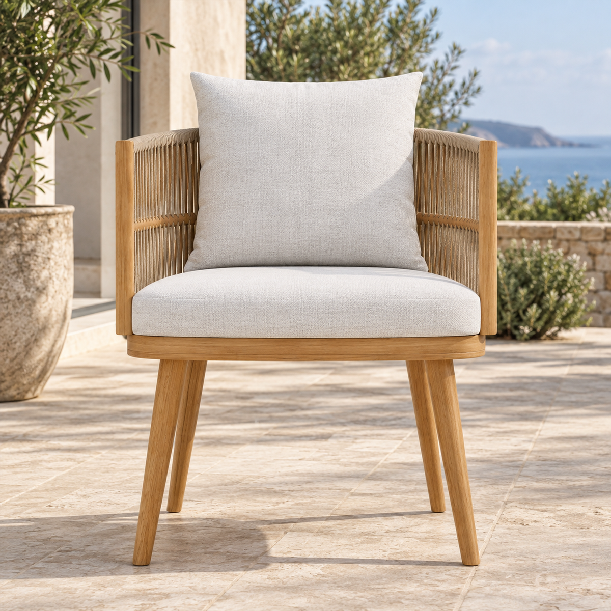 Ripple Dining Chair in Teak, complete front view on a coastal terrace