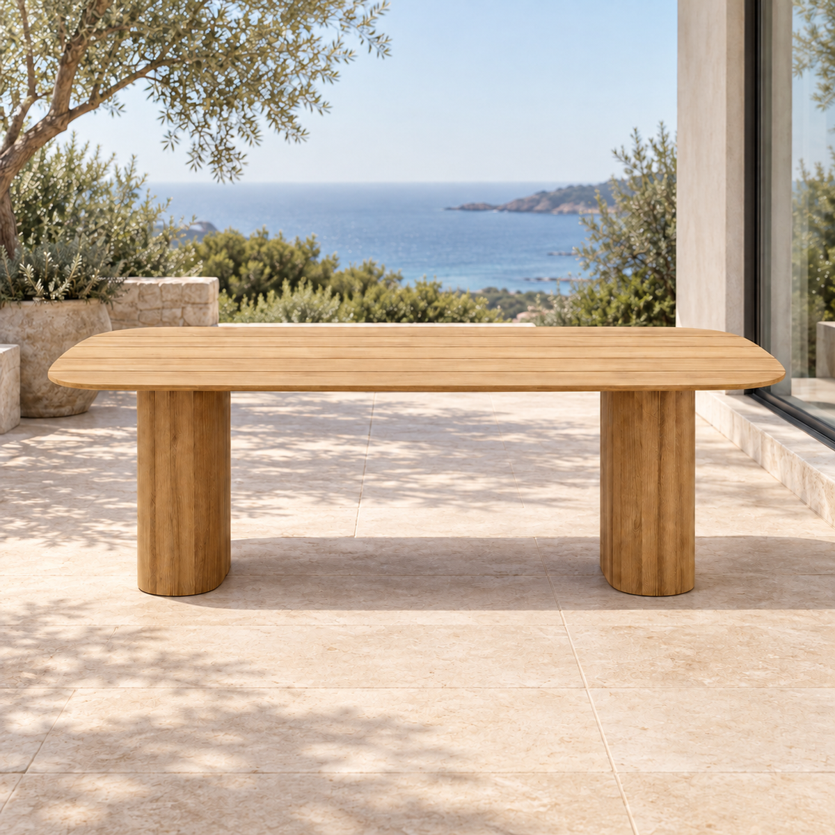 Lifestyle view: Ripple Dining Table in Teak, straight front view on a furnished coastal terrace