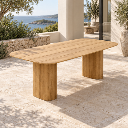 Lifestyle view: Ripple Dining Table in Teak, opposite diagonal on a coastal terrace