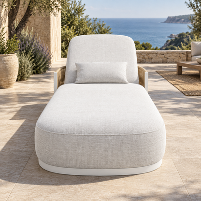 Lifestyle view: Ripple Flat Sun Lounger in Aluminium, straight foot-end view on a coastal terrace