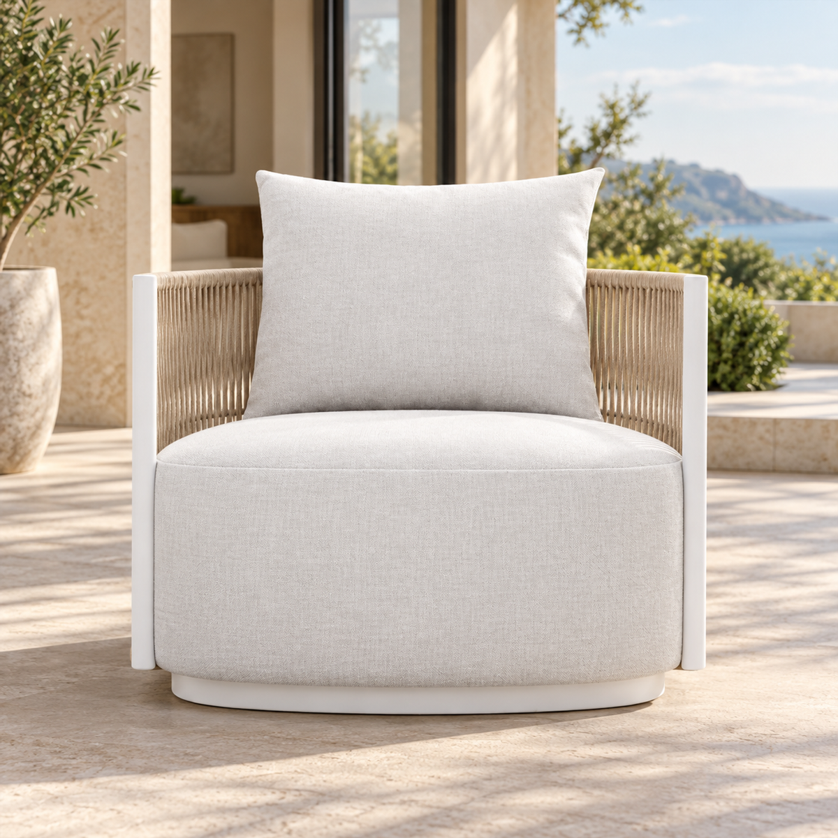 Lifestyle view: Ripple Lounge Chair in Aluminium, straight frontal view beside a furnished home