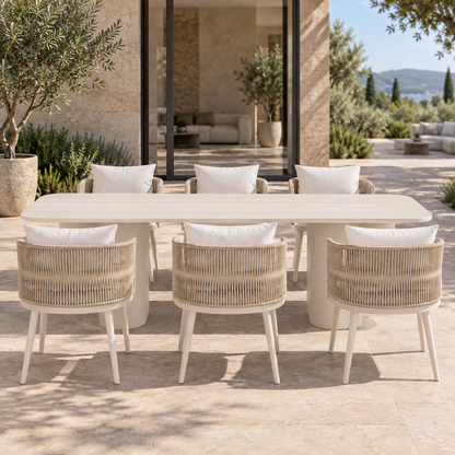 Lifestyle view: Ripple Outdoor Dining Set in Aluminium, frontal view beside a furnished garden home