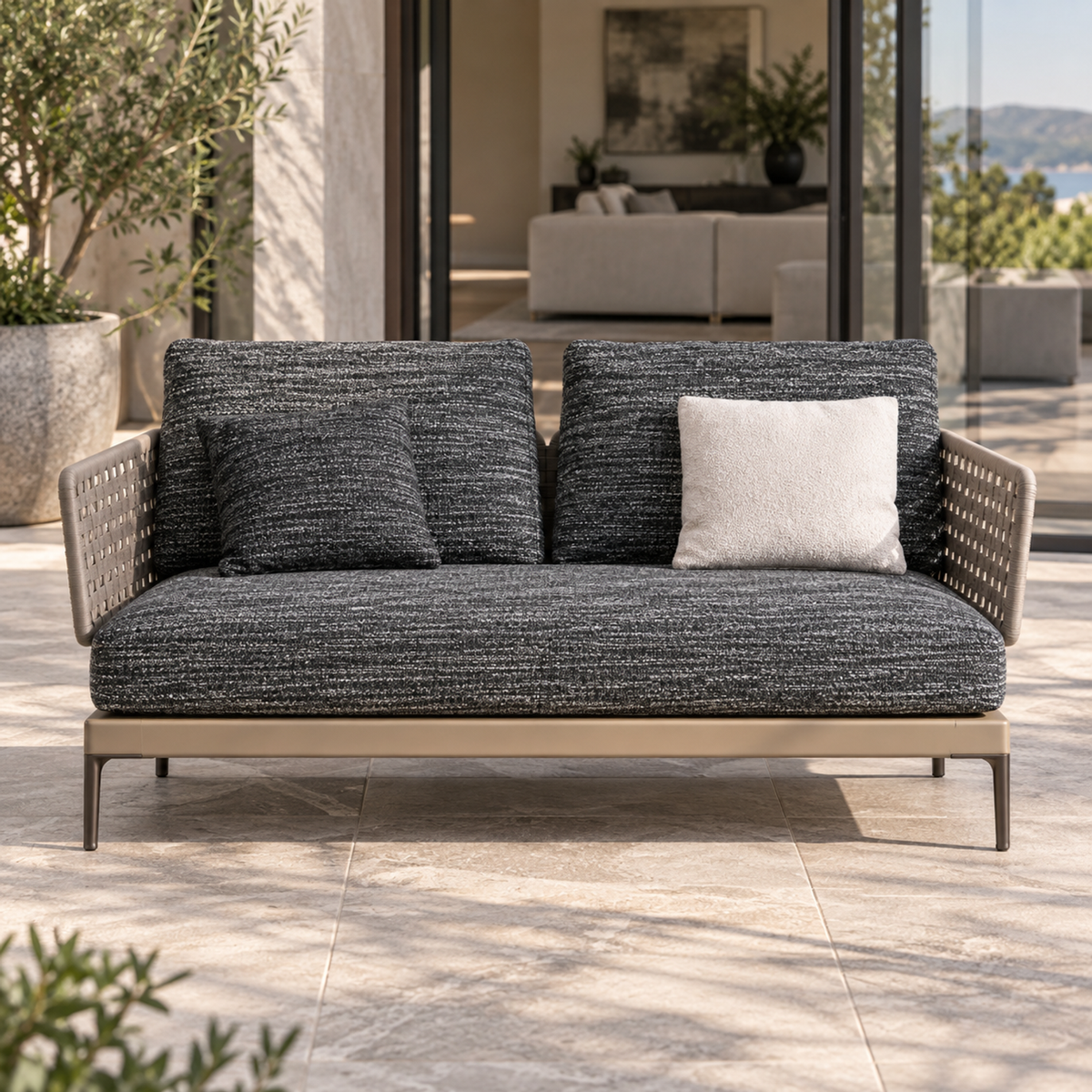 Lifestyle view: Salina Two-Seat Sofa on a furnished terrace