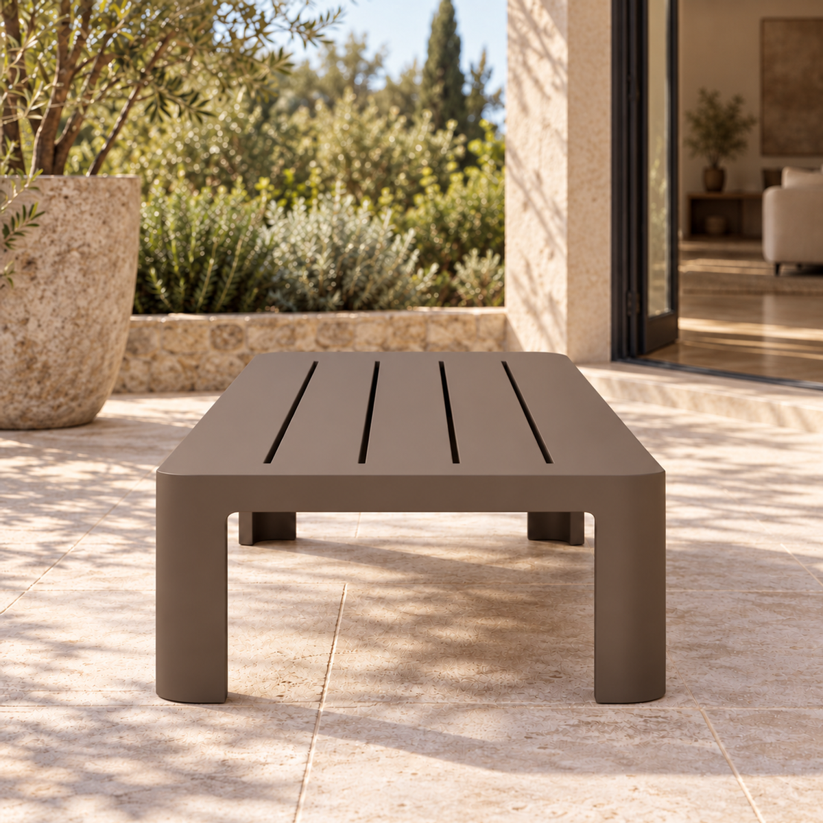 Serein aluminium coffee table, short-end view on a furnished home terrace