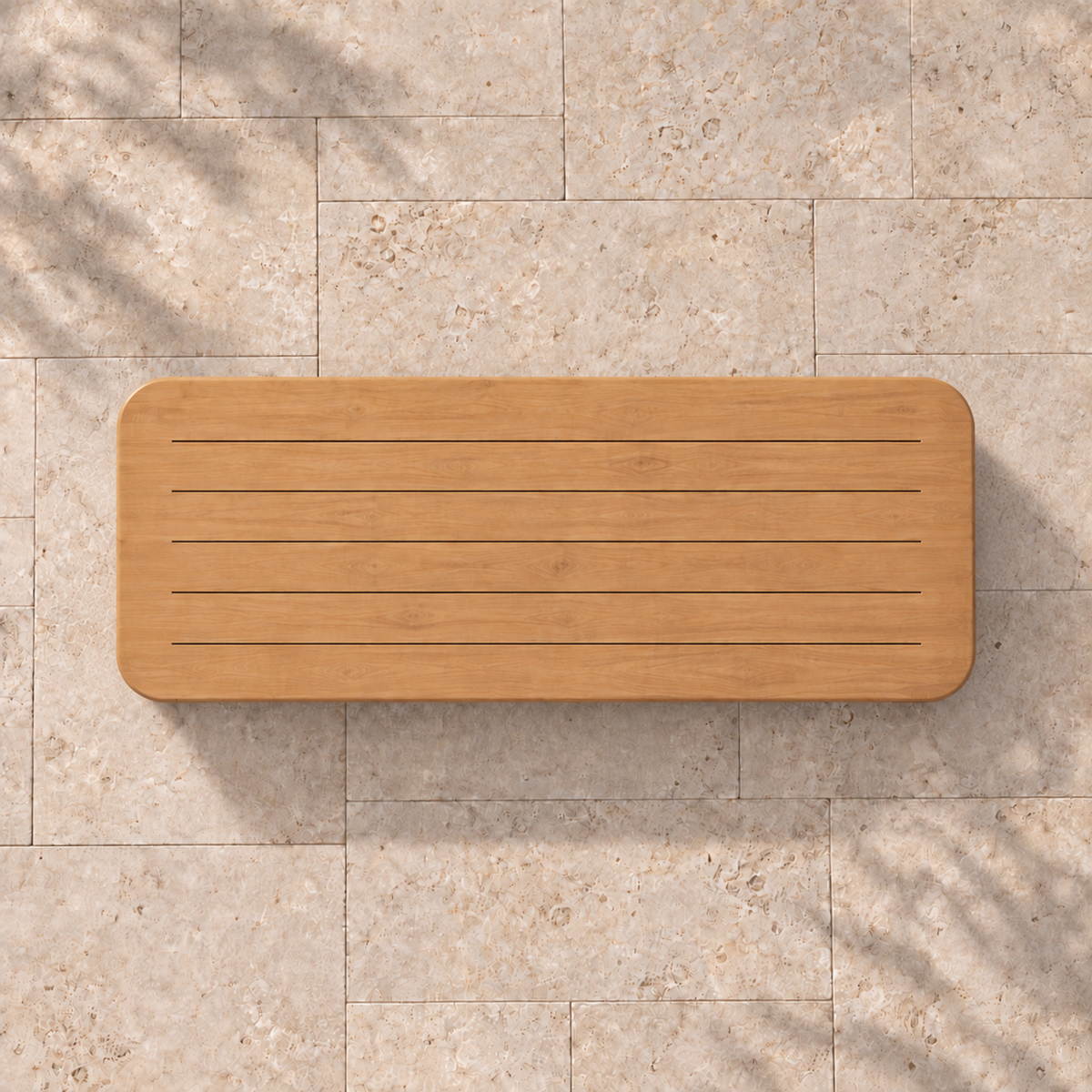 Serein teak dining table, overhead view on a stone home terrace