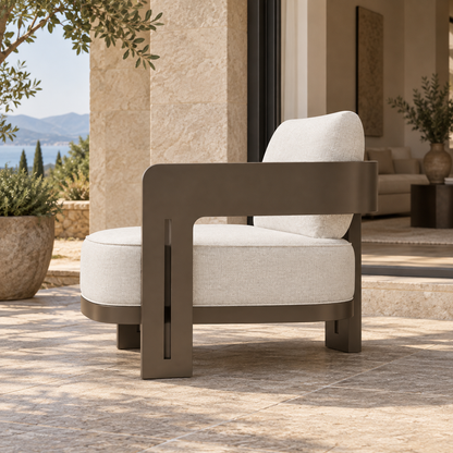 Serein aluminium lounge chair, side view on a furnished coastal terrace