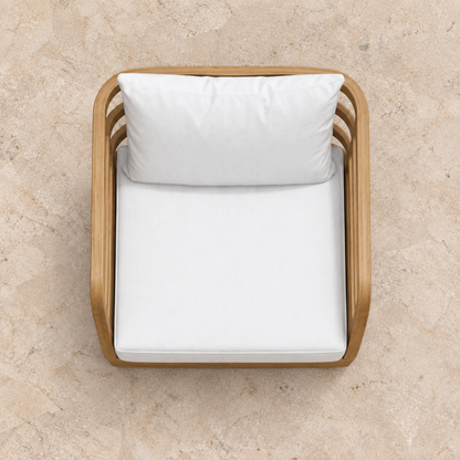 Vela teak lounge chair, overhead view on a stone terrace