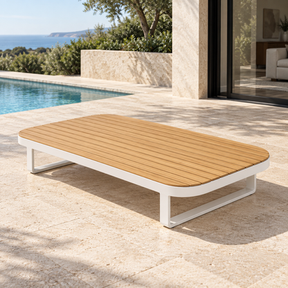 Lifestyle view: Vela Modular Coffee Table in Aluminium, photographed on a furnished outdoor terrace