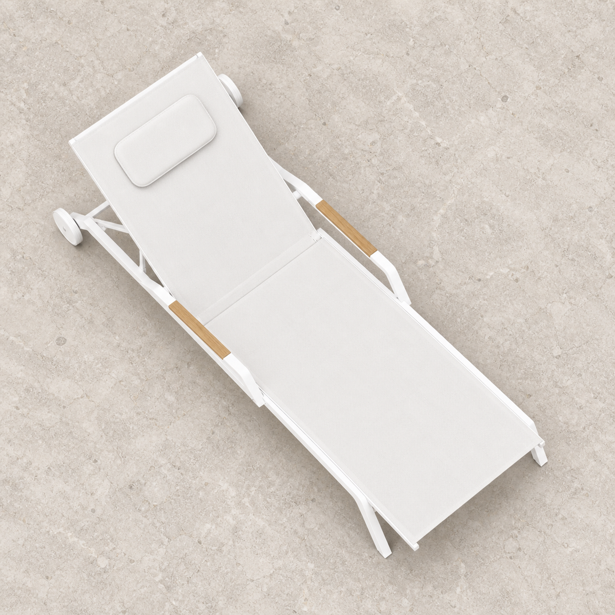 Vela aluminium poolside sun lounger, overhead view on a stone terrace