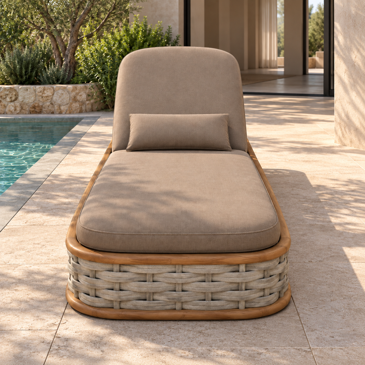 Vela woven teak sun lounger, foot-end view beside a home pool