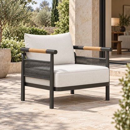 Zenia aluminium lounge chair, left diagonal beside a furnished home