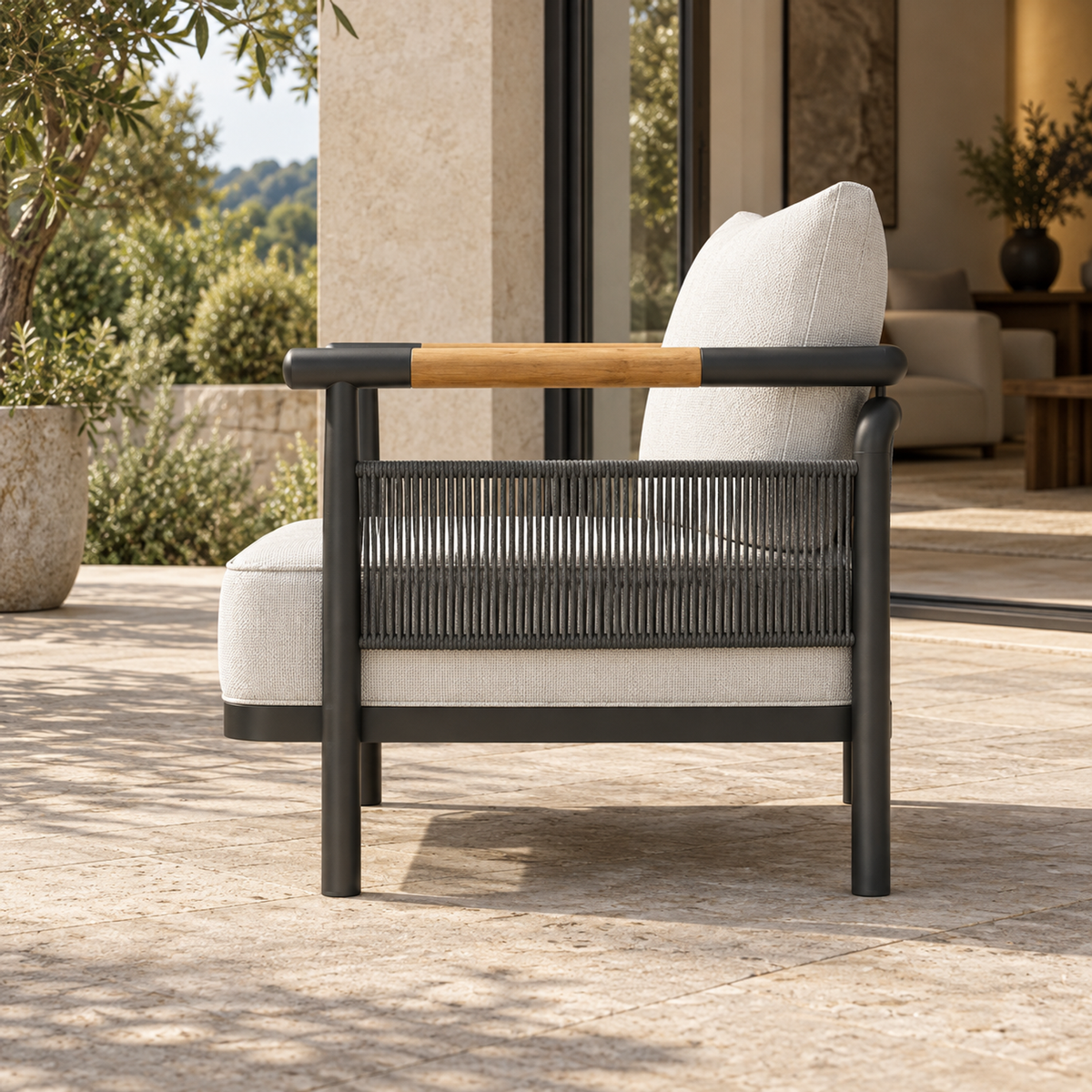 Zenia aluminium lounge chair, complete side profile on a home terrace