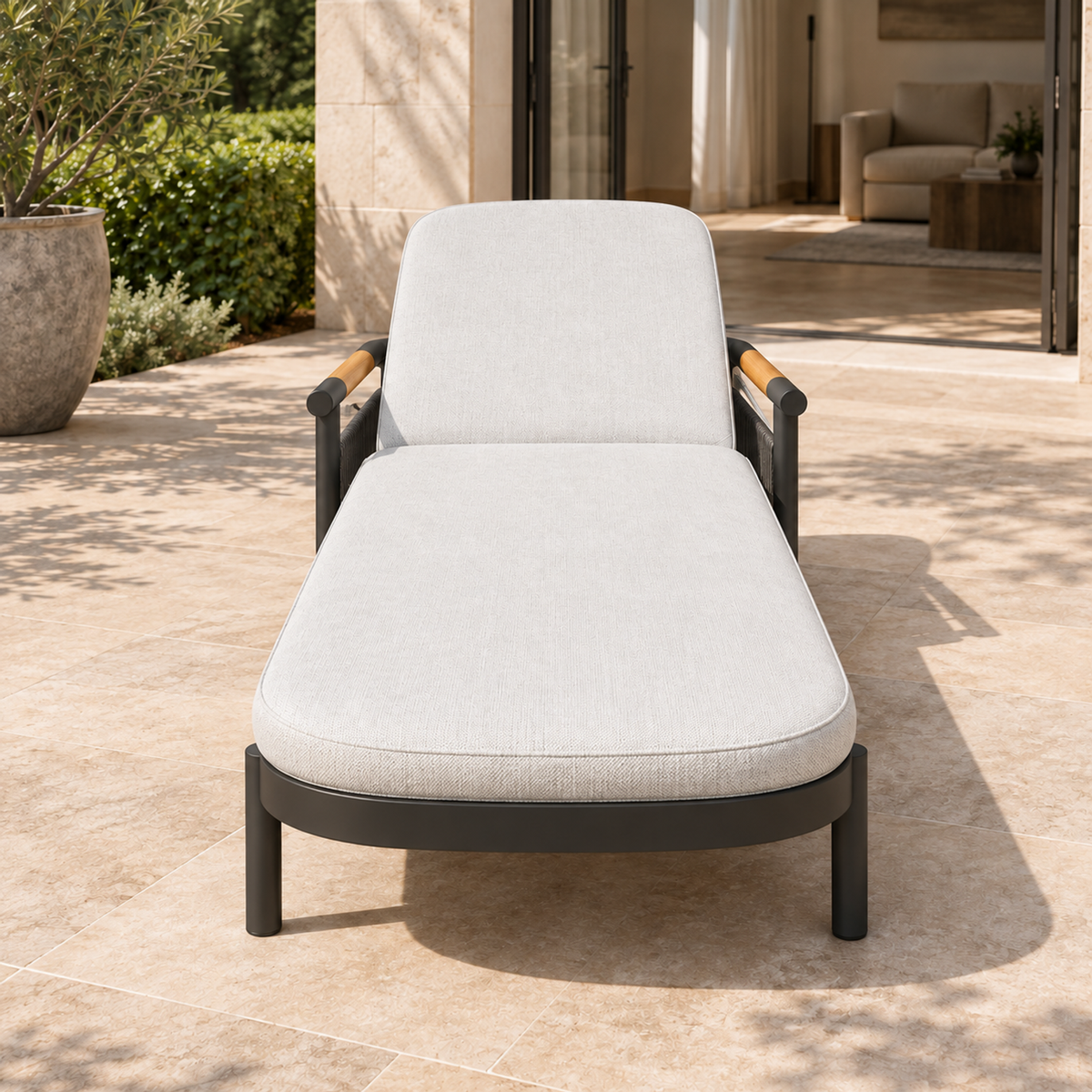 Lifestyle view: Zenia aluminium sun lounger, front foot-end view on a furnished home terrace