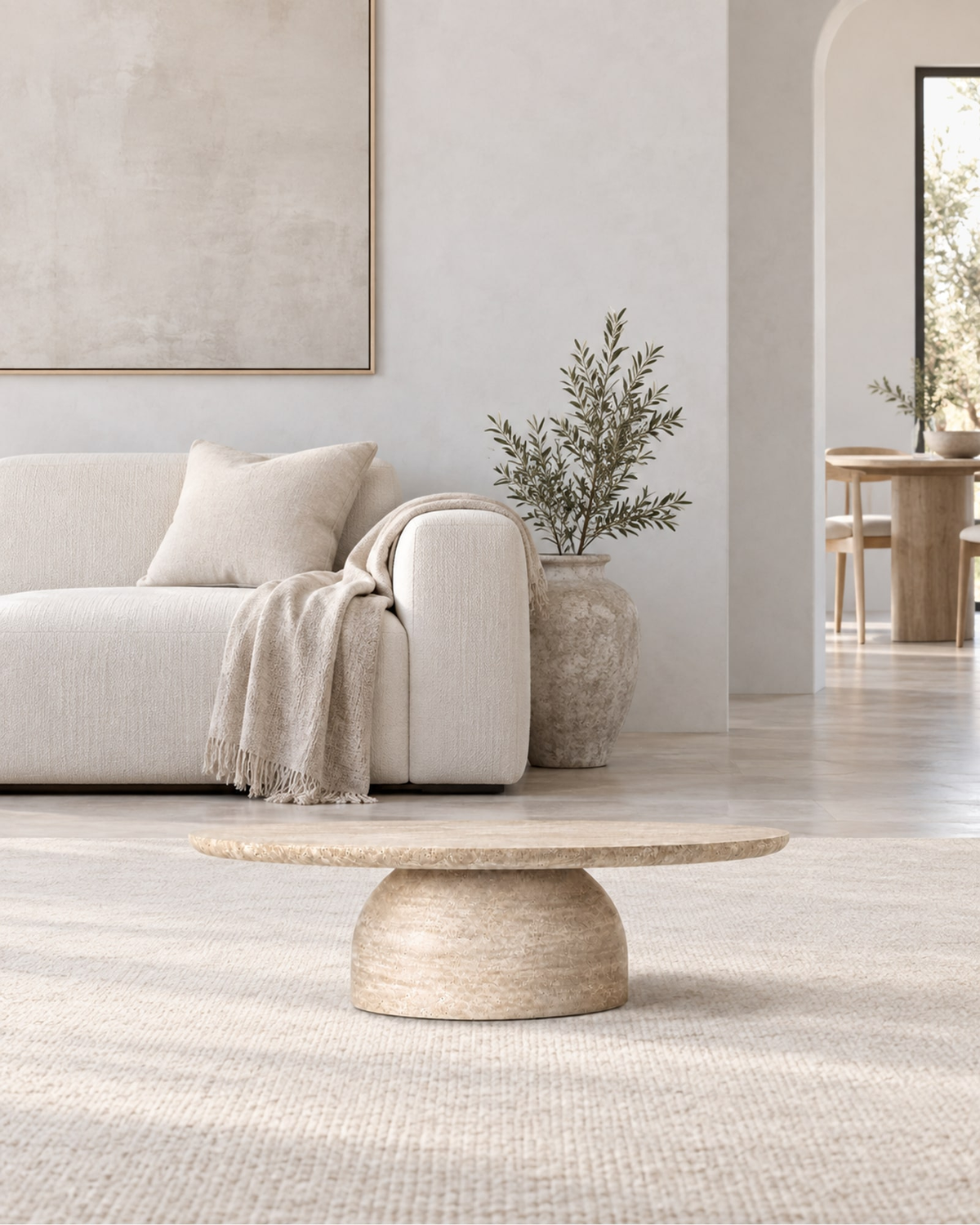Cupola Carved Round Coffee Table in a styled setting