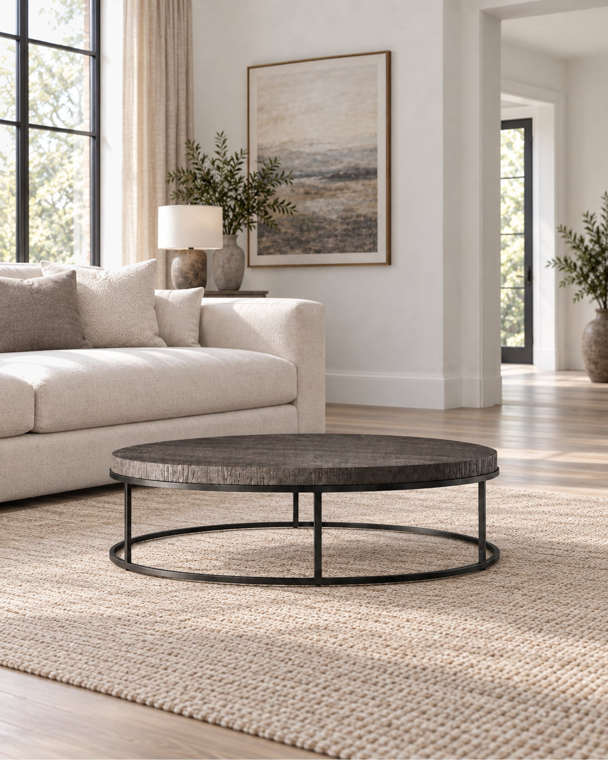Nicholas Oak Round Coffee Table in a styled setting