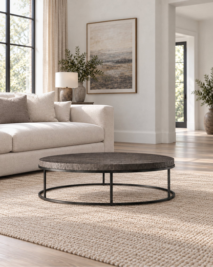 Nicholas Oak Round Coffee Table in a styled setting