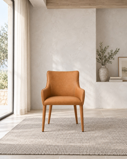 Nicola Slope Arm Vegan Leather Dining Armchair in a styled setting