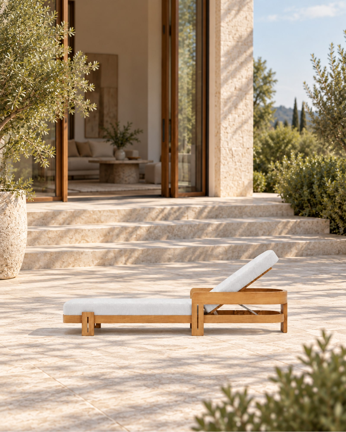 Serein Sun Lounger in Teak in a styled setting